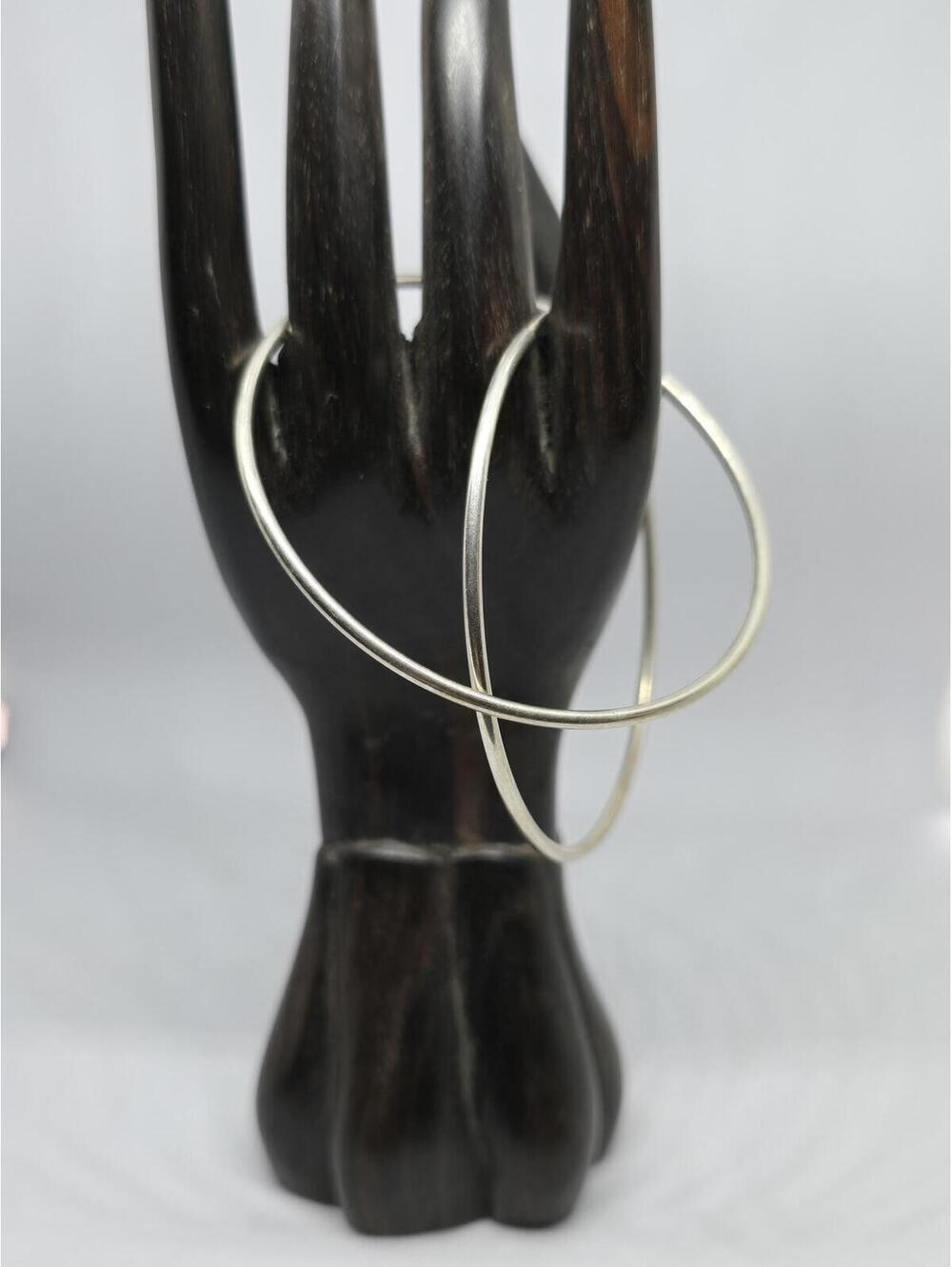Large sterling silver hoop earrings.